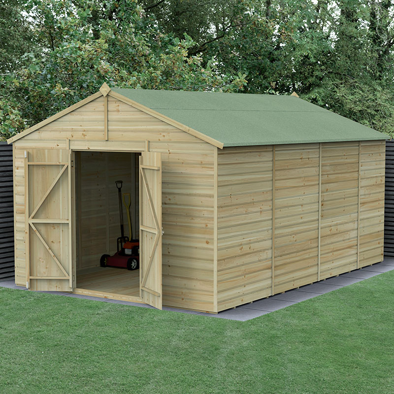 A wooden apex shed with a green felt roof, featuring double doors and shiplap cladding, set in a grassy area with trees in the background.