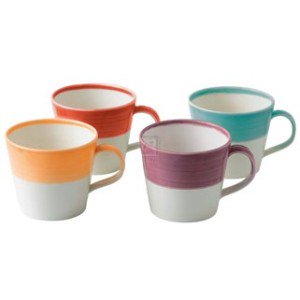 Set of four ceramic mugs in bright colors: orange, purple, turquoise, and white, featuring a two-tone design with a smooth finish and comfortable handles.