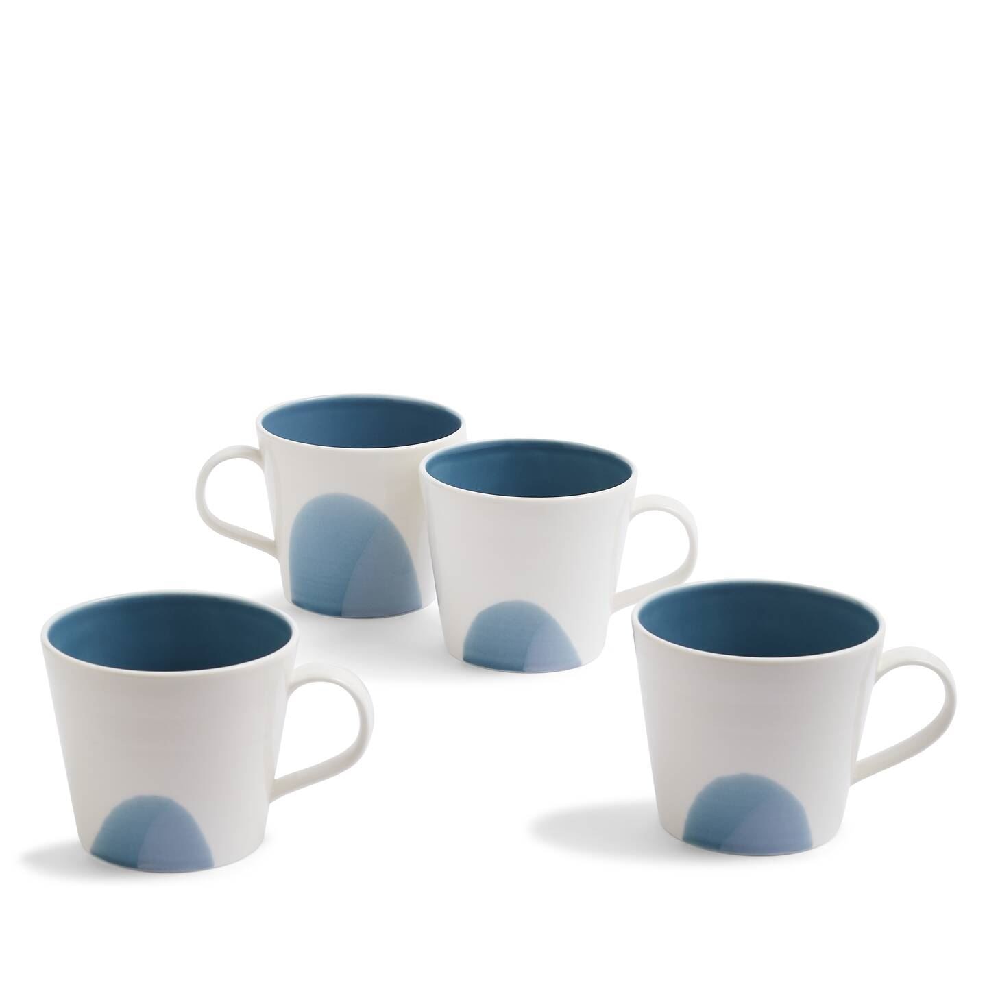 Set of four ceramic mugs in white with a soft blue interior and a subtle blue gradient design on the exterior, featuring a comfortable handle.