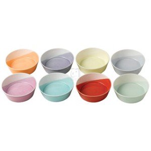 Set of eight ceramic dessert bowls in pastel colors, including orange, purple, yellow, light blue, and mint green, featuring a smooth, glossy finish and a contemporary design.
