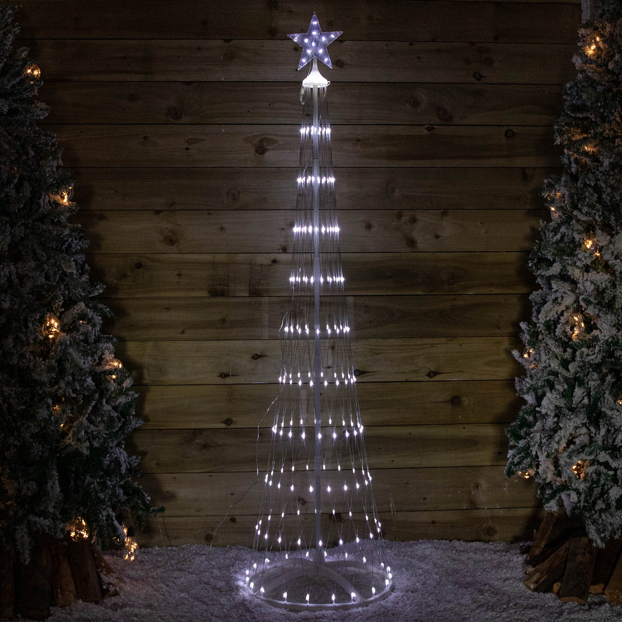 A 2.5m tall cone-shaped Christmas tree made of white lights, adorned with 320 white LEDs, topped with a star, set against a wooden backdrop.