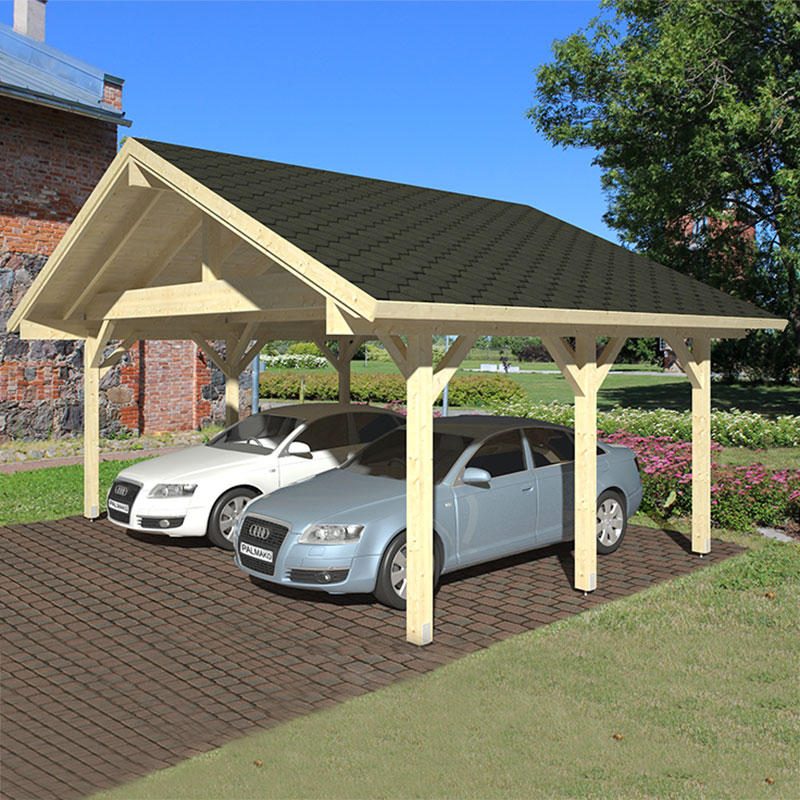 A wooden carport in light wood with a dark shingle roof, featuring an open design and supporting beams, accommodating two cars parked on a brick driveway surrounded by greenery.