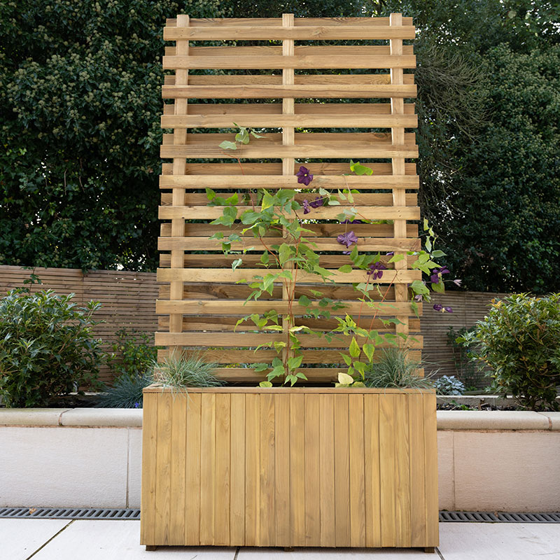 Forest Garden's wooden living wall planter features a slatted design with a natural wood finish, measuring 2'11" x 1'3", showcasing climbing plants and greenery at the base.