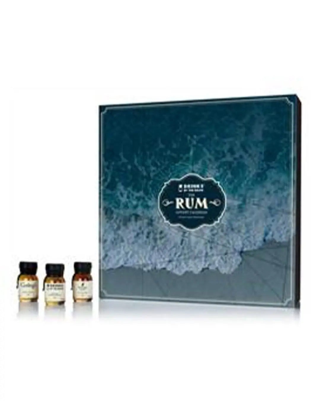 A blue and white box featuring a wave design, labeled "RUM," with three small rum bottles in front, showcasing a festive advent calendar theme.