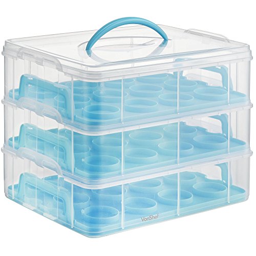 Transparent plastic cupcake carrier with three stacked layers, featuring a blue handle and 36 individual cupcake compartments.
