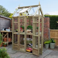 3' x 4' Forest Victorian walkaround greenhouse made of natural wood, featuring glass panels, a sloped roof, and multiple shelves for plants, set in a garden environment.