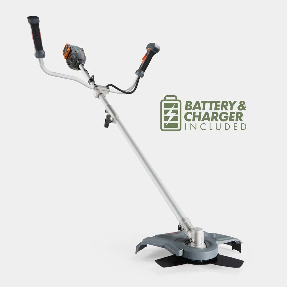 Cordless grass trimmer and brush cutter in grey, featuring a long metal shaft, ergonomic handles, and a cutting head with blades, with battery and charger included.