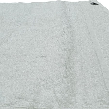 White 500 GSM institutional towels with slight imperfections, featuring a soft, plush texture and a neatly stitched edge, ideal for various uses.
