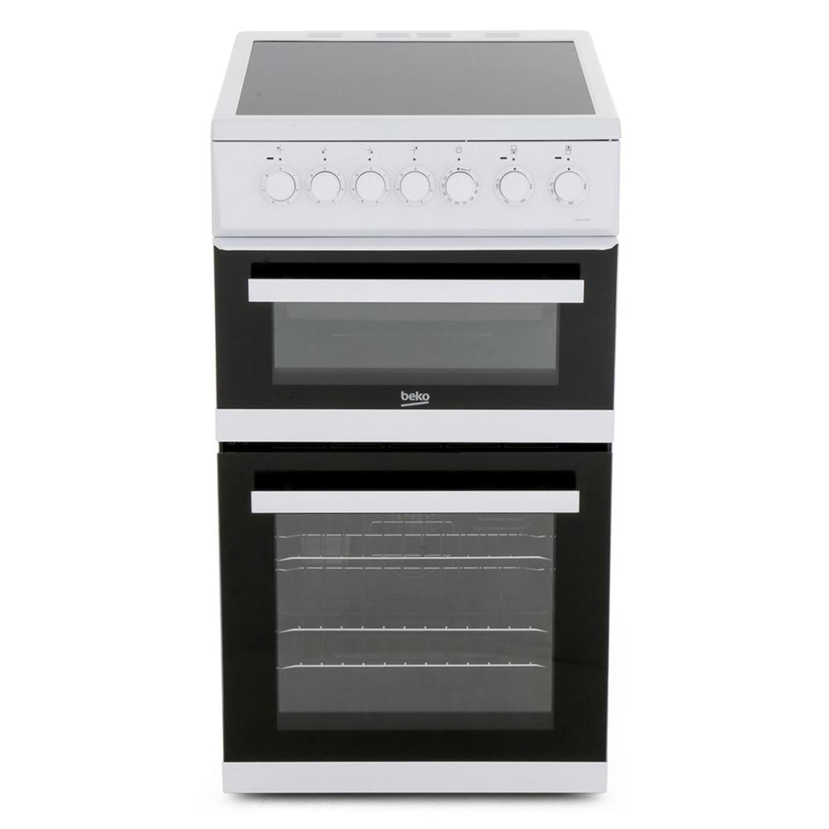 Beko EDVC503W electric double oven in white with a ceramic hob, featuring two black glass oven doors and six control knobs on the top.