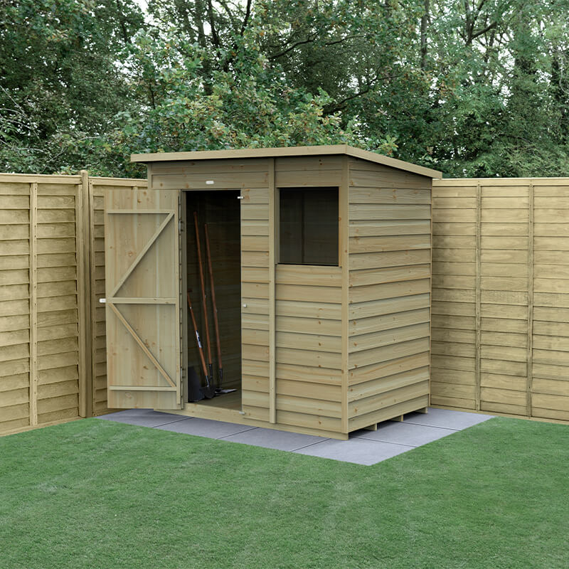 A wooden pent shed with a natural wood finish, featuring overlap cladding, a single door, and a window, set on a paved area within a green lawn and surrounded by wooden fencing.
