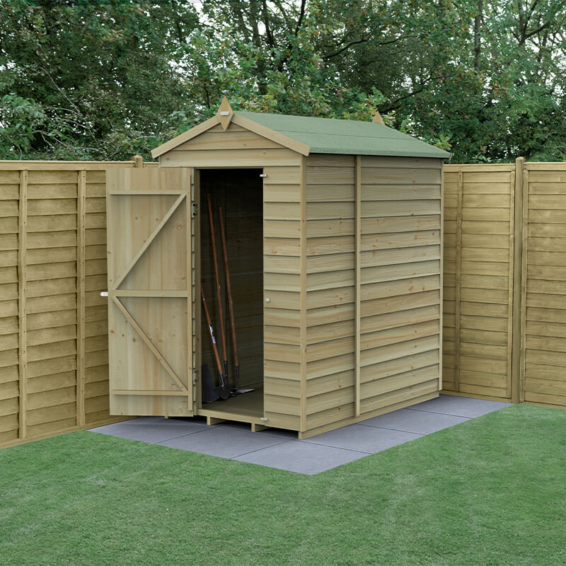 A wooden apex shed with a green felt roof, featuring pressure-treated overlap panels, an open door revealing interior space, and set on a paved area in a garden.