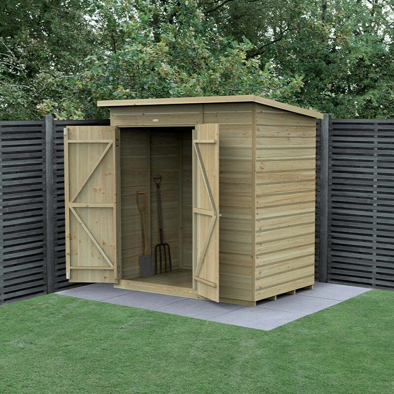 Wooden pent shed with a natural wood finish, featuring double doors, shiplap design, and pressure-treated timber, set on a grassy area with a dark wooden fence in the background.