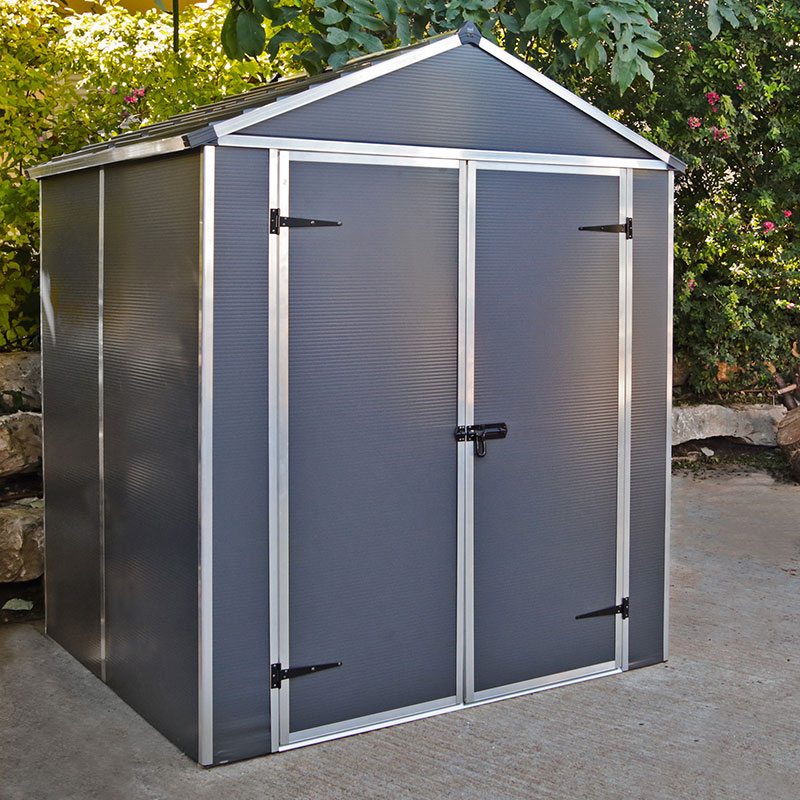 Dark grey multi-wall plastic shed with a peaked roof, double doors, and silver aluminum framing; includes a free shelf for storage.