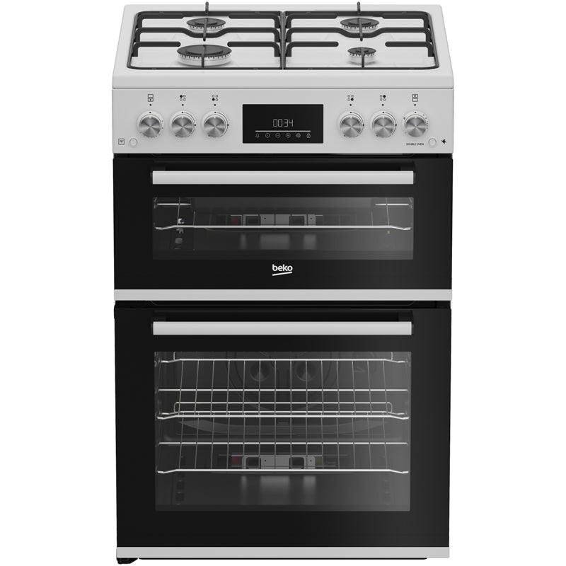 White 60cm twin cavity gas cooker with enamel hob, featuring four burners, stainless steel knobs, and two black glass oven doors with visible racks inside.