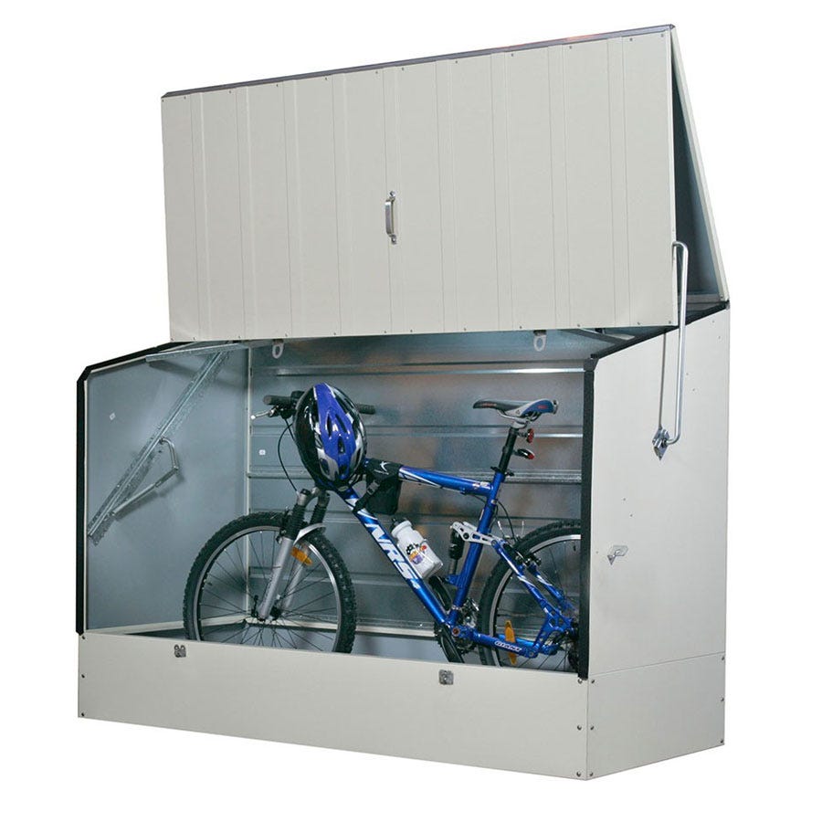 Cream-colored metal bike shed with a ramp, featuring a hinged top and transparent front, housing a blue bicycle and helmet inside.