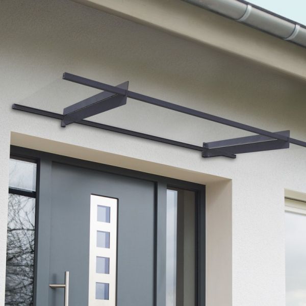 Grey door canopy with a modern design, featuring a sleek frame and horizontal bars, mounted above a contemporary entrance with a glass door and square window.