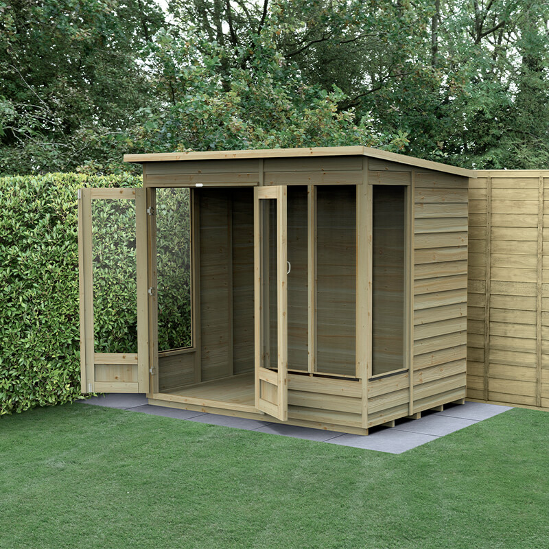 A wooden pent summer house with double doors, featuring a natural timber finish, large glass panels, and a sloped roof, set on a grassy area surrounded by greenery.