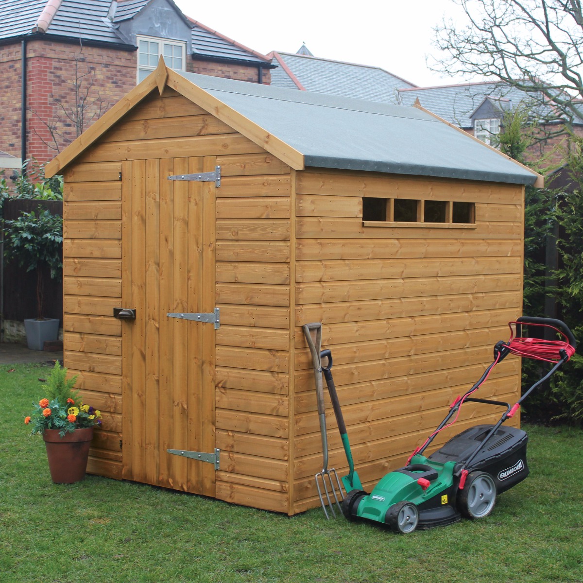 Traditional 8' x 8' wooden garden shed in natural wood finish, featuring an apex roof, double doors, and a small window, with a lawnmower and gardening tools beside it.