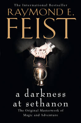 Black book cover featuring the title "A Darkness at Sethanon" in gold text, with the author's name, Raymond E. Feist, above, and a pair of hands holding a lantern at the center.