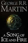 Collection box set of "A Song of Ice and Fire" by George R.R. Martin, featuring seven books with a dark cover and intricate gold emblem, showcasing a fantasy theme.