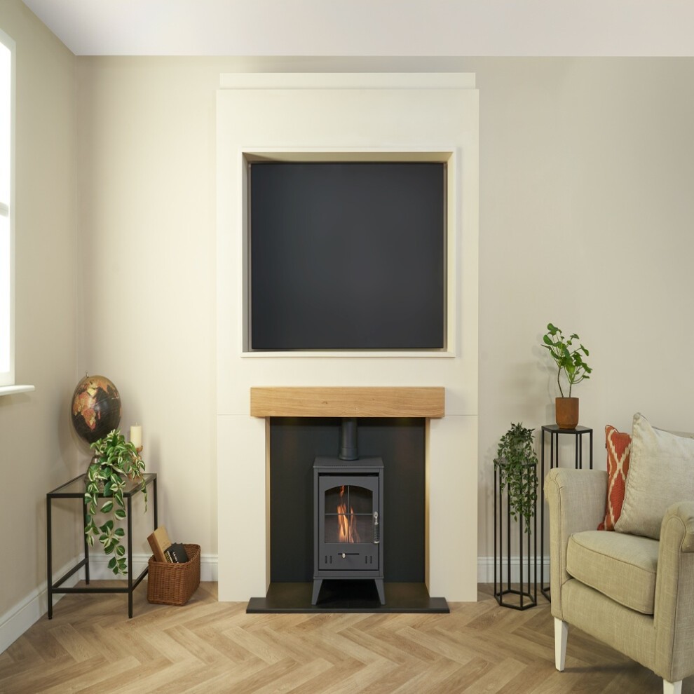 Acantha Pre-Built Stove Media Wall features a sleek white design with a wooden mantel, a recessed area for a TV, and an OKO S2 Bio Ethanol stove in a modern living space.