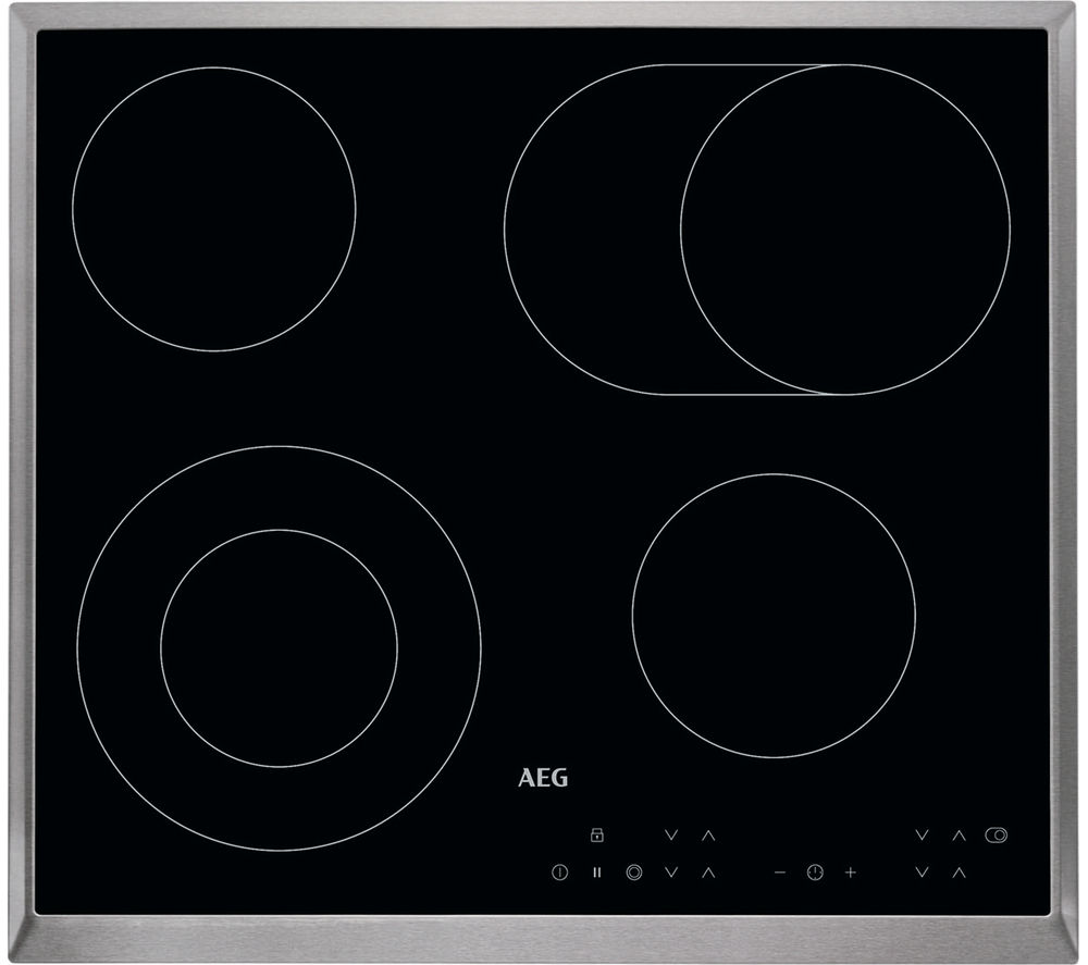 Black glass induction cooktop with four circular heating zones, stainless steel trim, and touch control panel featuring temperature settings and indicators.