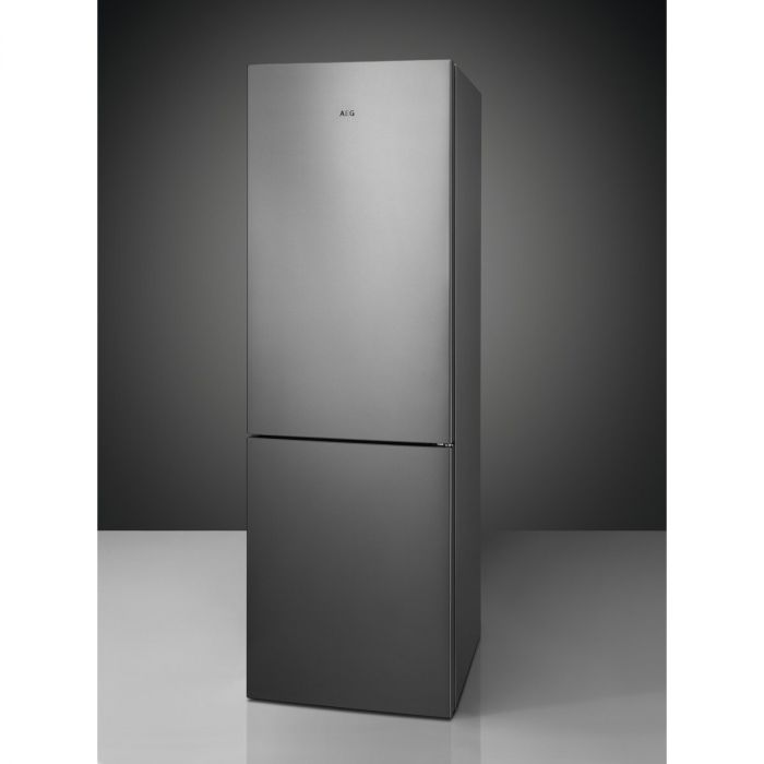 Sleek silver AEG RCB632E2MX No Frost fridge freezer with a modern design, featuring a top fridge compartment and a bottom freezer, set against a dark background.