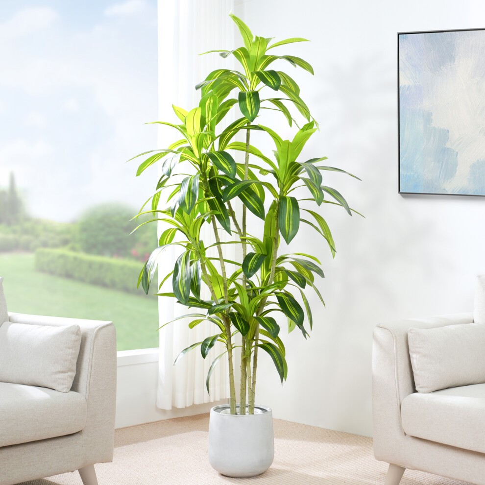 Tall artificial agave tree with vibrant green leaves in a textured white plastic planter, complemented by decorative moss, set against a bright window backdrop.