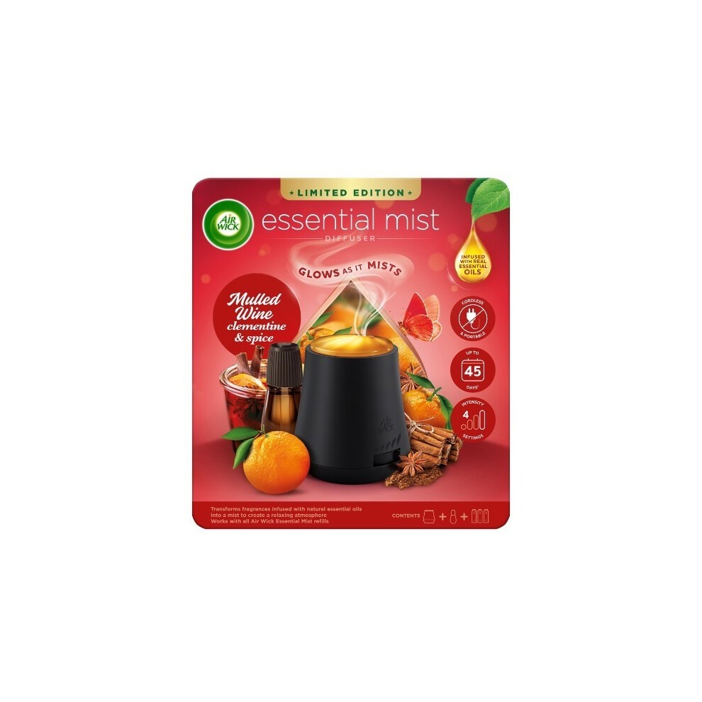 Air Wick Essential Oil Mist Kit featuring a black diffuser, a glass bottle of mulled wine-scented oil, and vibrant orange and spice accents on the packaging.
