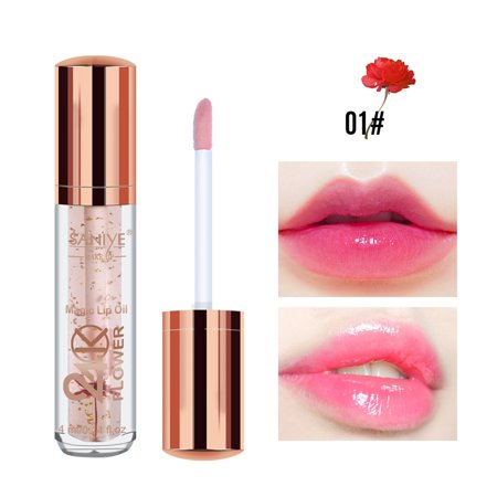 Clear tube with 24K gold foil and dried flowers, featuring a rose gold cap; includes a doe-foot applicator and showcases soft pink lip color on lips.