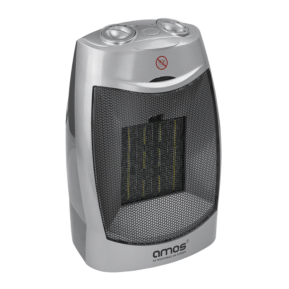 Compact silver ceramic fan heater with a mesh front, featuring two control knobs on top and a warning sign, designed for desk use with 1500W power and two heat settings.