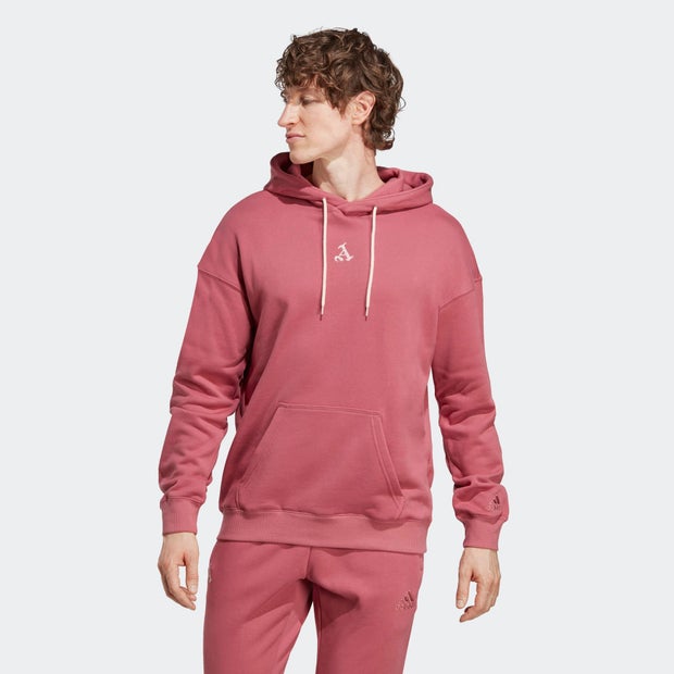 Pink Adidas hoodie featuring a front pocket, drawstring hood, and a small logo on the chest, made from soft, comfortable material.