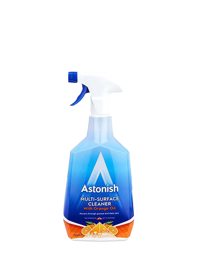 A blue and clear plastic spray bottle with a white trigger, labeled "Astonish Multi-Surface Cleaner" featuring an orange grove scent, designed for heavy-duty kitchen cleaning.