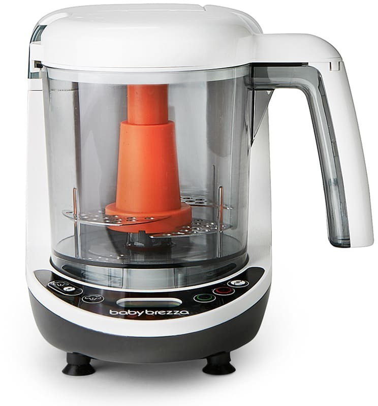 White and black Baby Brezza One Step Baby Food Maker Deluxe with a transparent bowl, orange steaming insert, and control buttons on the front for easy food preparation.