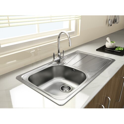 Compact stainless steel inset sink with one bowl, featuring a polished finish, integrated drainer, and a sleek chrome faucet, set against a light countertop and wooden cabinetry.