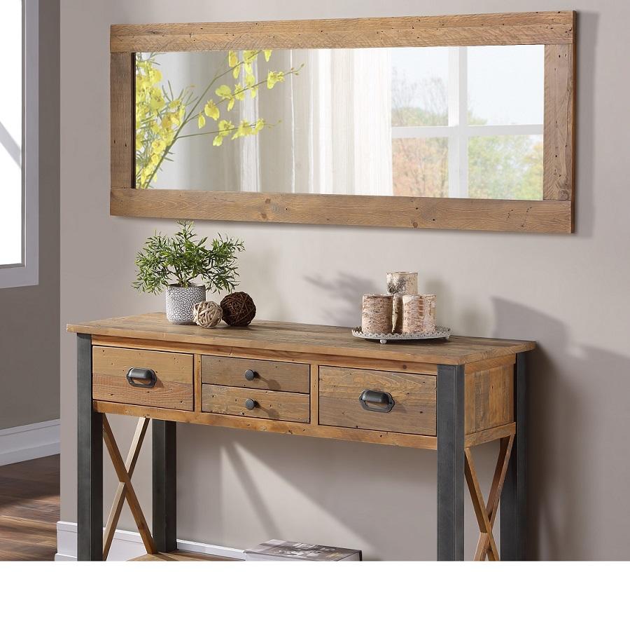 Reclaimed wood wall mirror with a brown frame, featuring a sleek, extra-long design, mounted above a rustic console table with drawers and decorative items.