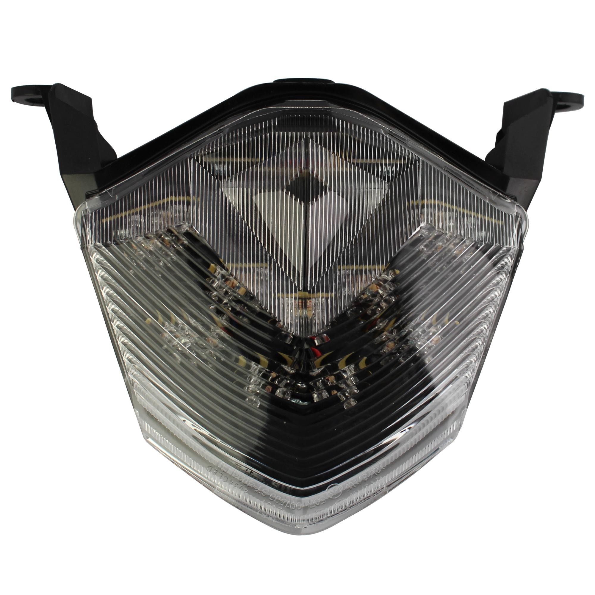 LED rear tail light with a clear lens, featuring integral indicators, designed for Kawasaki Z750 models from 2007 to 2012, showcasing a sleek, angular shape and multiple light elements.