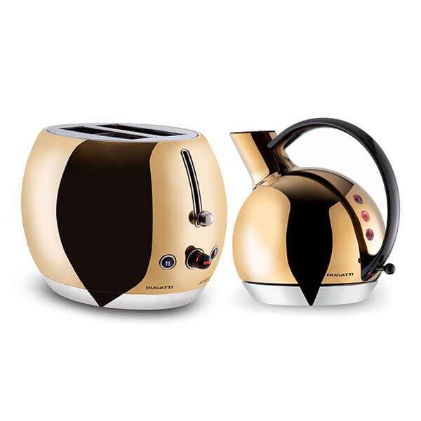 Gold and black Bugatti Giulietta kettle with a sleek handle and modern design, paired with a matching gold toaster featuring two slots and a stylish, rounded shape.