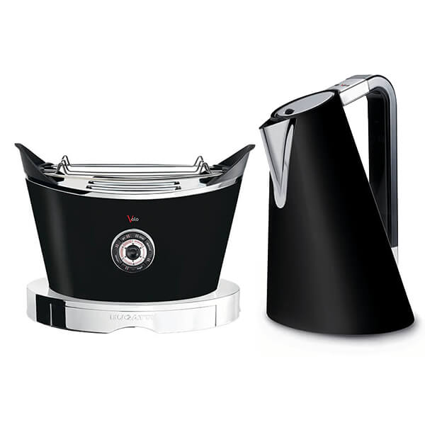 Sleek black kettle with a modern design and chrome accents alongside a stylish black toaster featuring a shiny chrome front and a dial control.