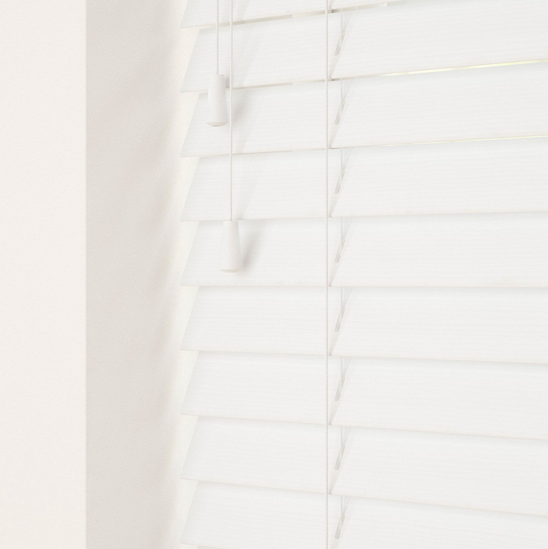 Faux wood string Venetian blind in a clean white finish, featuring horizontal slats and pull cords for easy adjustment, set against a light-colored wall.