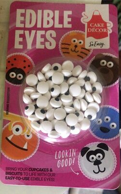 Round, white edible eyes with black pupils in a clear package, featuring colorful cartoon faces and the text "Cake Décor Edible Eyes" on a pink background.