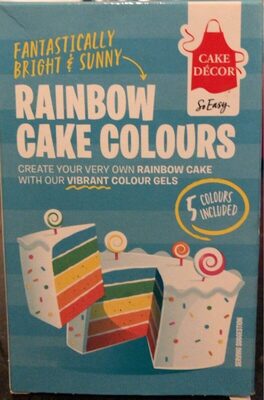 Brightly colored packaging featuring "Rainbow Cake Colours" by Cake Décor, showcasing five vibrant color gels for cake decoration, with a cheerful design and swirled lollipop accents.