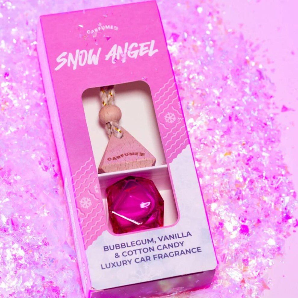 Pink packaging with "Snow Angel" label, featuring a diamond-shaped purple air freshener and a wooden tag, scented with bubblegum, vanilla, and cotton candy.