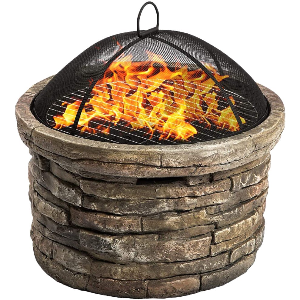 Khaki Majestic Heater fire pit with a round stone base, eco-stone finish, and a black mesh spark guard, featuring vibrant flames visible through the top.