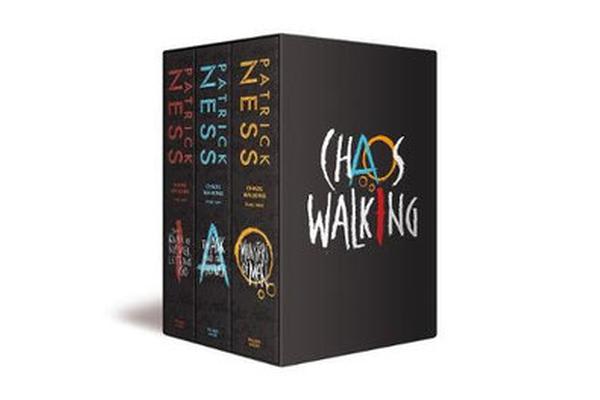 Boxed set of "Chaos Walking" trilogy by Patrick Ness, featuring three black book spines with colorful titles and a prominent, stylized "Chaos Walking" logo on the front.