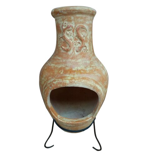 Large yellow terracotta clay chiminea with a decorative design, featuring a wide opening and supported by a black metal stand.