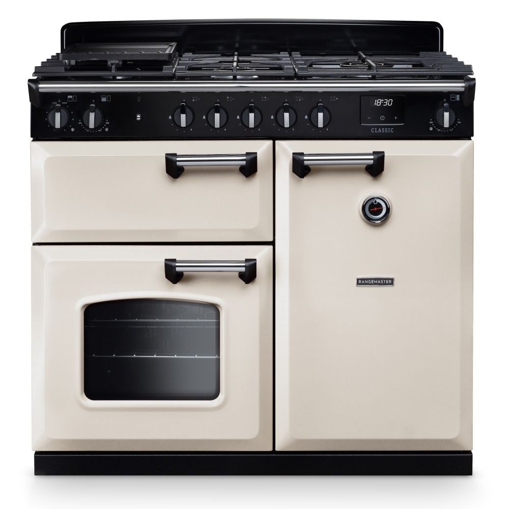 Classic 100cm dual fuel cooker in pale cream with chrome accents, featuring a five-burner gas hob, two ovens, and stylish black control knobs.