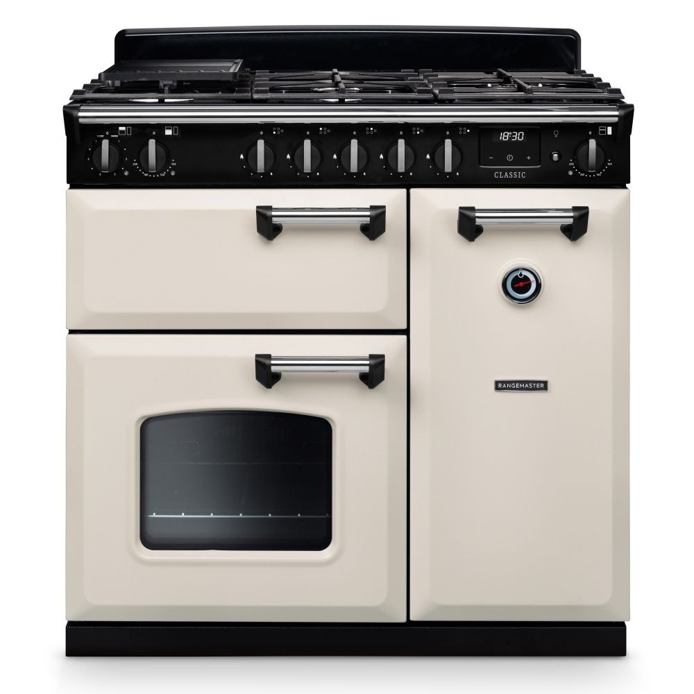 Classic 90cm dual fuel cooker in pale cream with chrome accents, featuring a black gas hob, six control knobs, and a large glass-fronted oven with a chrome handle.