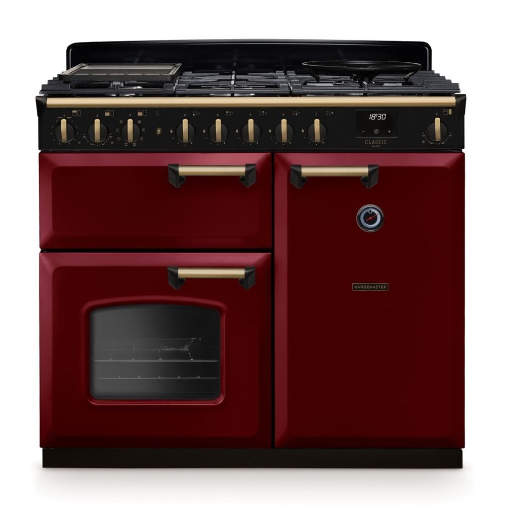 Classic Deluxe 100cm dual fuel range cooker in Bordeaux with antique brass accents, featuring a five-burner gas hob, two ovens, and a sleek black control panel.