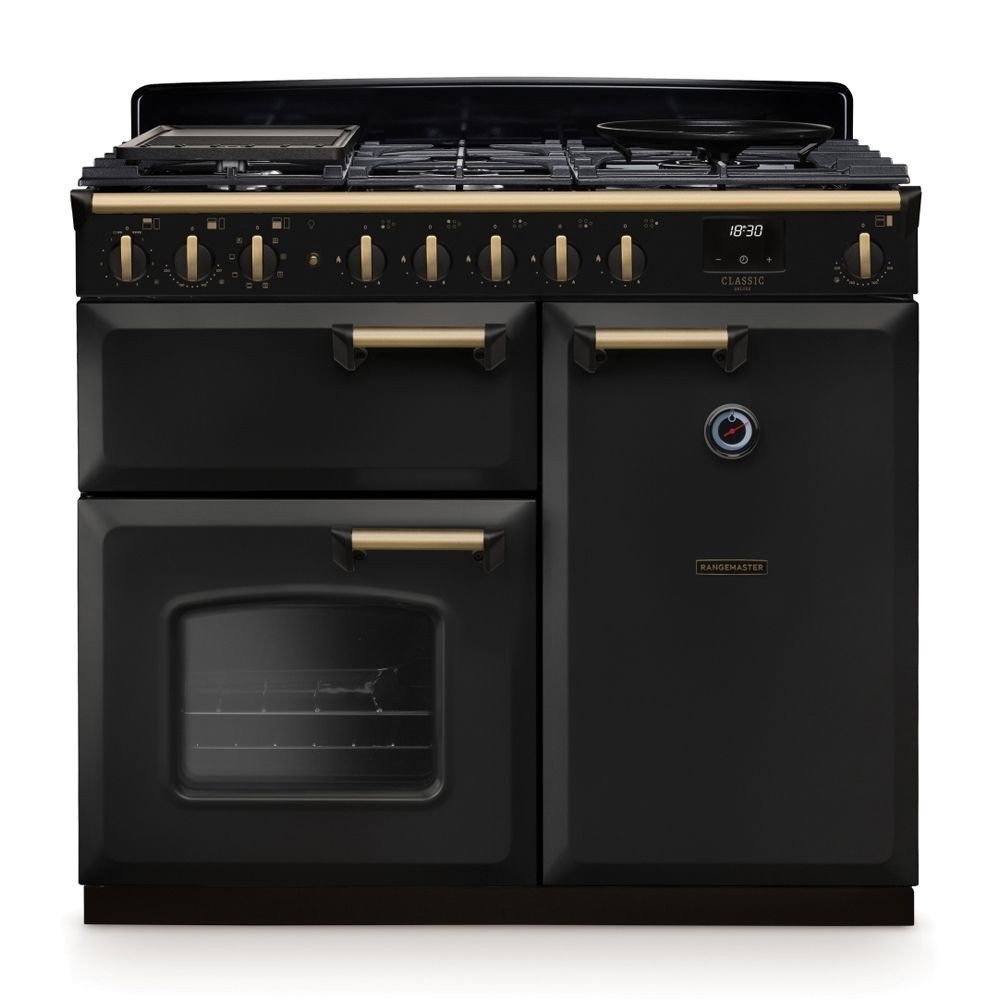 Classic Deluxe 100cm dual fuel range cooker in charcoal black with antique brass accents, featuring multiple burners, an oven window, and stylish control knobs.